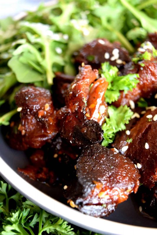 Moist and tender, with charred bits too, these Honey Garlic Baked Pork Bites are delicious and easy to prepare. Despite the long cooking time, this main is perfect for a family dinner anytime. Sweet and garlicky, with an optional kick of spice and heat. Yum! #pork #baked #bites #honey #garlic