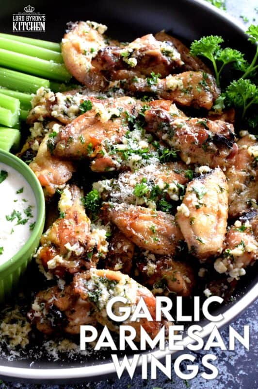 Chicken wings should be easy to prepare and taste great and those two simple rules are applied to these Garlic Parmesan Chicken Wings. With so much flavour, it's hard to believe that they are baked in an oven!  Tossed in a garlicky, cheesy, butter sauce, there never seems to be enough of these to please everyone! #garlic #garlicky #parmesan #cheese #chicken #wings #baked