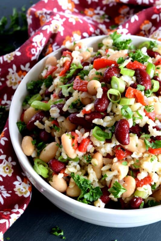 A light, fresh taste with just a hint of sweetness, this protein-packed Bean and Brown Rice Salad is vegetarian-friendly and is a quick and easy side or main.  20 minutes from start to finish and you're good to go! Great for summer picnics or a quick weekday lunch too! #bean #salad #kidney #brown #rice