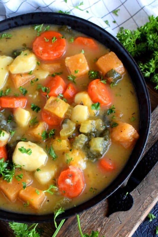 Hearty meals, much like this Chunky Vegetable and Spinach Soup, are heart-healthy and filling.  It's a delicious vegetarian soup that once again proves that meat does not need to be present at every meal. On colder nights, serve this soup with buttered crusty bread for even more home-style comfort! #soup #vegetarian #spinach #hearty #vegetables #healthy