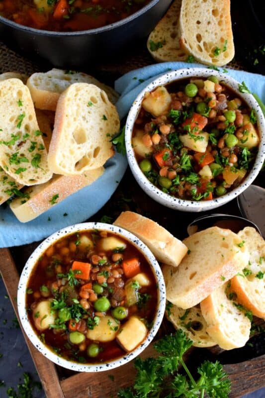Finally a bowl of lentil soup with a nice thin broth, yet one that's hearty and filling enough to fight the cold weather chills! Loaded with good-for-you vegetables, and prepared with a savoury vegetable broth, this freezer-friendly soup is simply delicious! #soup #vegetables #lentils #broth