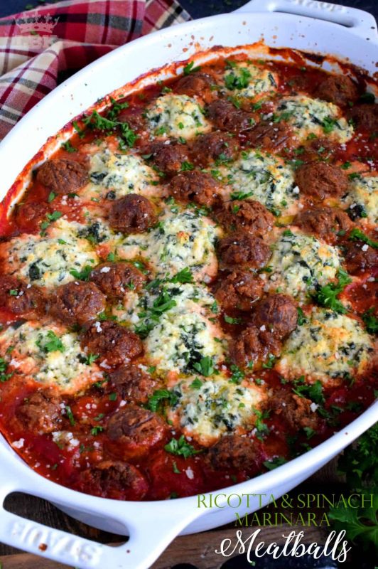 Your favourite meatballs baked in a ricotta and spinach marinara with herbs and parmesan - spoon over pasta for a delicious Sunday family supper!#ricotta #spinach #marinara #meatballs