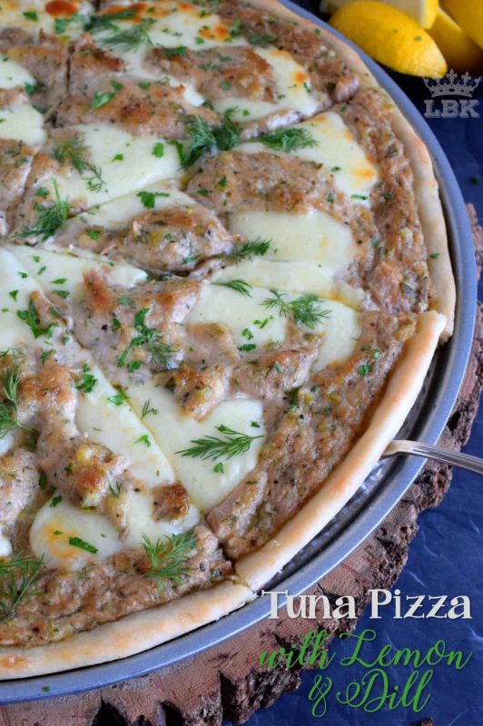 A homemade pizza, topped with tuna salad made with dill and lemon, then baked to perfection with gooey mozzarella cheese; original, unique, and delicious!#pizza #homemade #crust #canned #tuna #dill #lemon #fresh