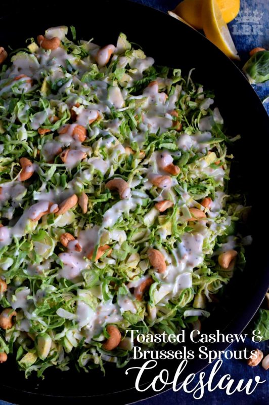 This non-traditional coleslaw consists of uncooked shaved Brussels sprouts which have been tossed with toasted cashews in a homemade tangy and zesty sauce. #brussels #sprouts #coleslaw #salad #raw #toasted #cashews