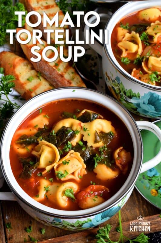 This soup is a complete meal! Not only is it hearty and filling, it's also very delicious! Tomato Tortellini Soup is a wholesome and nutritious meal that is quite easy to prepare and only takes about forty minutes from start to finish! It's loaded with aromatics and fresh spinach too! #soup #pasta #tomato #tortellini