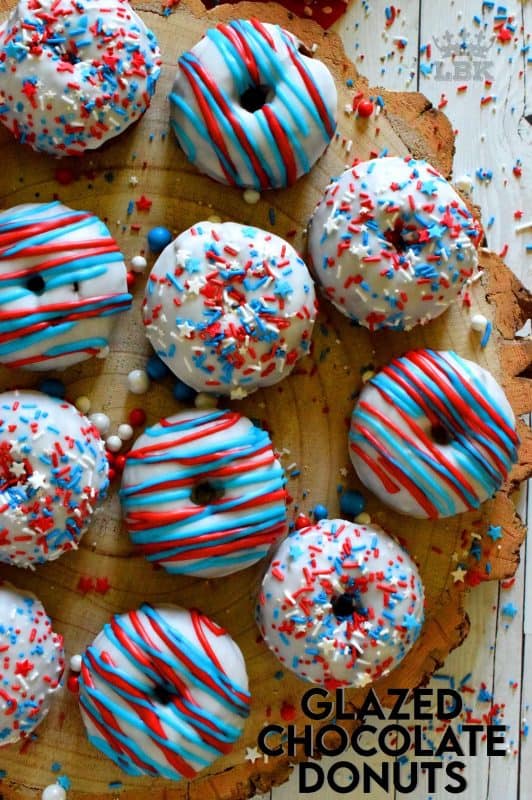 Covered in red, white, and blue frosting and sprinkles, these Glazed Chocolate Donuts scream fourth of July! These will surely be the hit of your family celebrations!#glazed #chocolate #donuts #baked #4thofjuly #sprinkles #patriotic