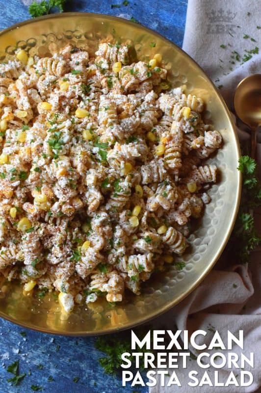 Creamy, refreshing, and cool, Mexican Street Corn Pasta Salad is a great addition to any summertime meal. With lots of zest and spice, you're sure to hear a lot of yums!#Mexican #streetcorn #corn #pasta #salad #summer #picnic #potluck