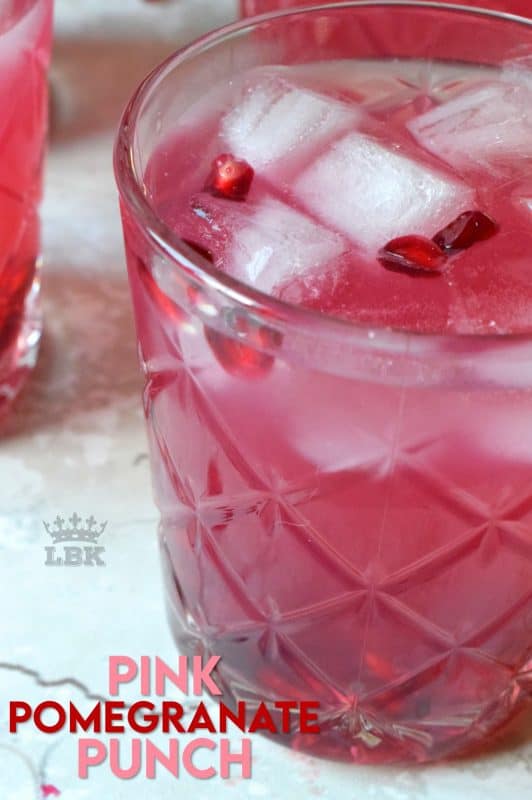 Summer requires lots of hydration and this Pink Pomegranate Punch is just the thing to quench your thirst. Easy, cheap, and delicious - what more could you want from a refreshing summer drink?#pomegranate #punch #pink #summer #drinks #virgin