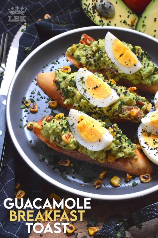 Guacamole Breakfast Toast makes for a full and hearty breakfast. Toasted bread piled with avocado, corn, and tomatoes; topped with wedges of hard boiled egg. A perfectly delicious meal anytime of the day! #avocado #guacamole #breakfast #toast #bread