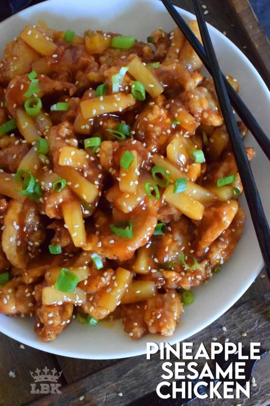 Pineapple Sesame Chicken is a little sweet and a little sour. It's prepared with boneless, skinless chicken thighs, pineapples and pineapple juice. Finished with toasted sesame seeds and green onions, this dish is completely delicious! #pineapple #chicken #chinese #asian #cooking #homemade #takeout