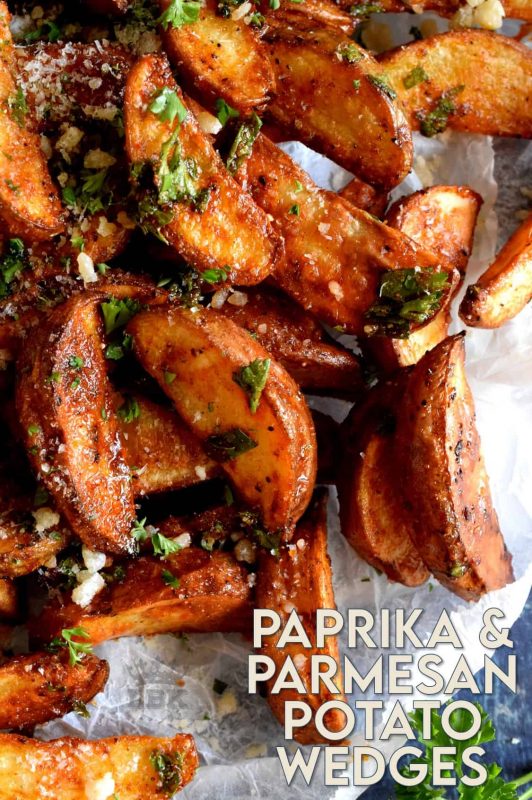 Roasted to perfection and perfectly seasoned, Paprika and Parmesan Potato Wedges are the perfect side dish - smoky, garlicky, onion-y, and cheesy - could these get any better? #potato #wedges #baked #roasted #paprika #parmesan
