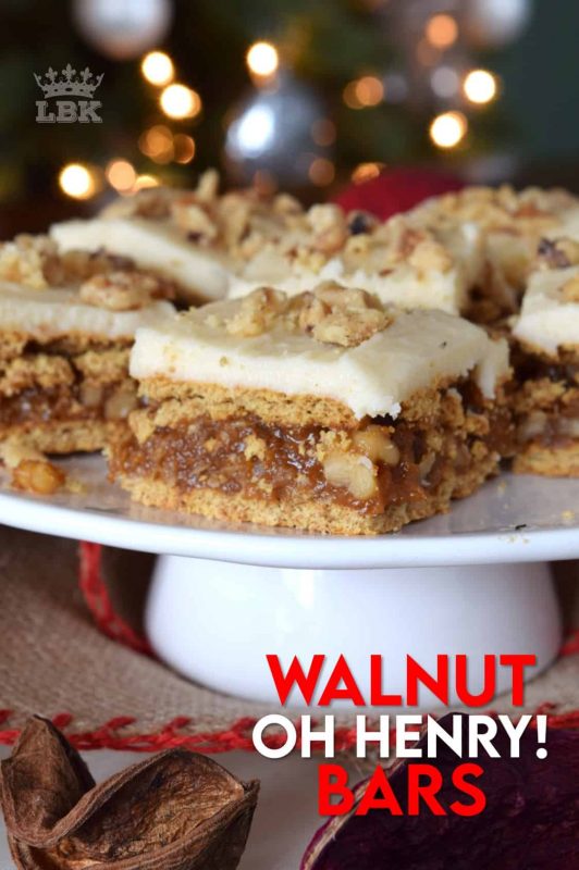 A caramel, walnut, and coconut filling, sandwiched between graham crackers, and topped with a simple buttercream frosting. Walnut Oh Henry Bars are a deliciously classic Newfoundland Christmastime recipe. #walnut #ohhenry #bars #copycat #christmas #baking #cookies #squares