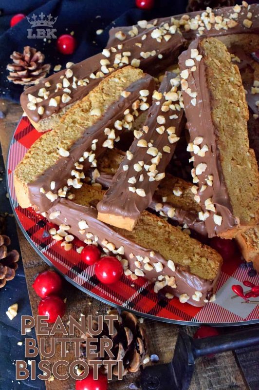 A delicious crisp confection that tastes just as good as it looks! Peanut Butter Biscotti is loaded with peanut butter flavour and paired with melted milk chocolate! #peanutbutter #biscotti #cookies #chocolate #christmas #baking #holiday