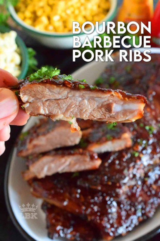 Bourbon Barbecue Pork Ribs are fall-off-the-bone tender. They are slow baked in the oven and basted with a thick and glossy, spicy and sweet, partially homemade bourbon barbecue sauce. Half a rack per person sounds right, yes!? #porkribs #bourbon #barbecue #oven #ribs