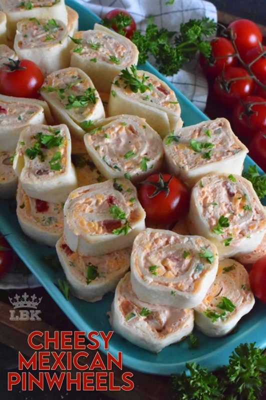 Is it a meal or is it an appetizer? I guess that all depends on how many of these you eat! Cheesy Mexican Pinwheels are easy to assemble, has lots of cheese, sour cream, and salsa too! Make them mild or be bold and up the heat factor! #mexican #pinwheels #appetizers #partyfood #rollups