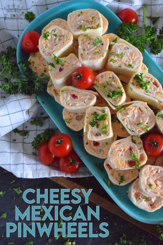 Is it a meal or is it an appetizer? I guess that all depends on how many of these you eat! Cheesy Mexican Pinwheels are easy to assemble, has lots of cheese, sour cream, and salsa too! Make them mild or be bold and up the heat factor! #mexican #pinwheels #appetizers #partyfood #rollups
