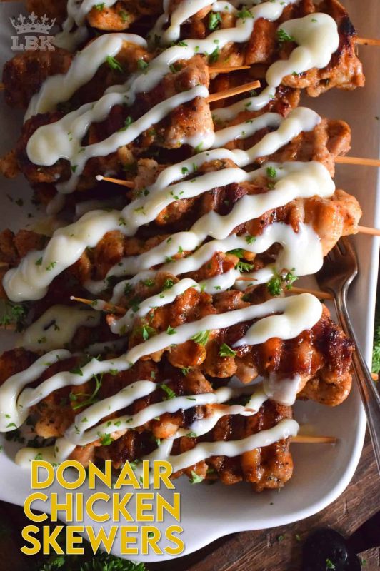 Donair Chicken Skewers are prepared with marinated chicken thighs in a make-at-home Greek seasoning blend, and then grilled to perfection. Topped with a homemade donair sauce, these skewers will be an immediate new family favourite! #donair #chicken #skewers #grilled #sauce #foodonsticks