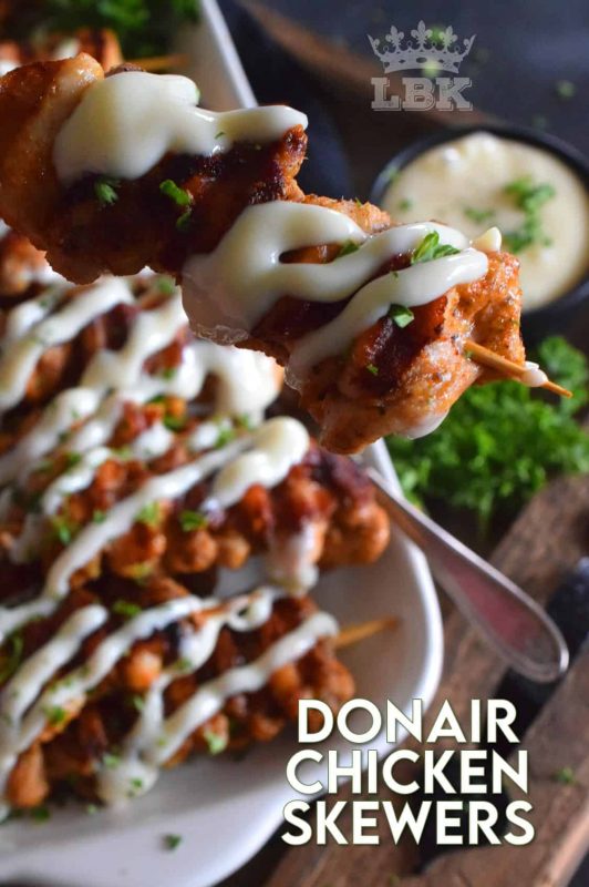 Donair Chicken Skewers are prepared with marinated chicken thighs in a make-at-home Greek seasoning blend, and then grilled to perfection. Topped with a homemade donair sauce, these skewers will be an immediate new family favourite! #donair #chicken #skewers #grilled #sauce #foodonsticks