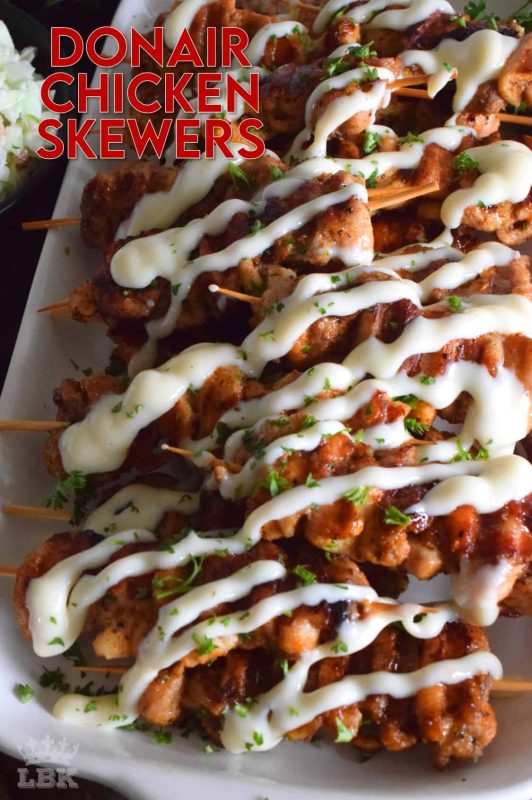 Donair Chicken Skewers are prepared with marinated chicken thighs in a make-at-home Greek seasoning blend, and then grilled to perfection. Topped with a homemade donair sauce, these skewers will be an immediate new family favourite! #donair #chicken #skewers #grilled #sauce #foodonsticks