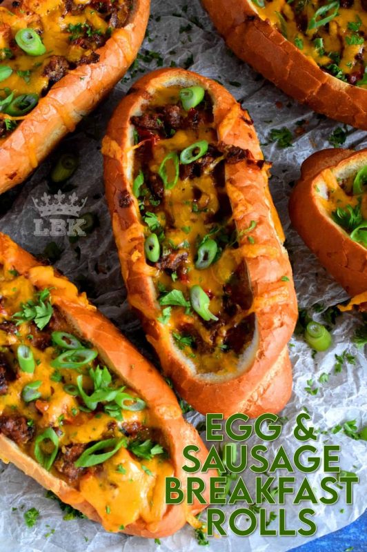 This dish has everything a good traditional breakfast needs - eggs, meat, and bread. Egg and Sausage Breakfast Rolls are delicious, easy, and fun too! It's as simple as hollowing out rolls, filling them with egg, sausage, and cheese, before baking them until the cheese is melted and bubbly. Sounds delicious, right? #sausage #sausageandegg #breakfast #sausagerolls #brunch