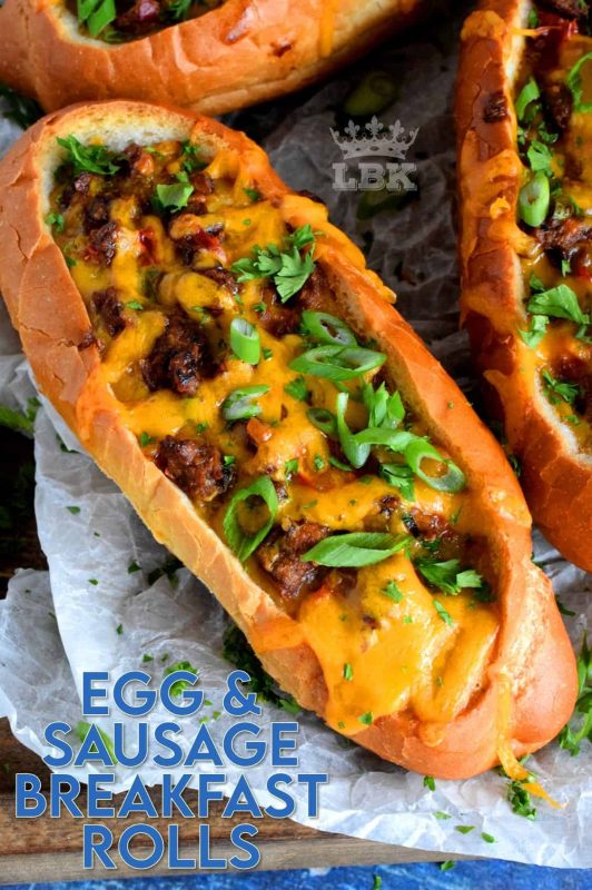This dish has everything a good traditional breakfast needs - eggs, meat, and bread. Egg and Sausage Breakfast Rolls are delicious, easy, and fun too! It's as simple as hollowing out rolls, filling them with egg, sausage, and cheese, before baking them until the cheese is melted and bubbly. Sounds delicious, right? #sausage #sausageandegg #breakfast #sausagerolls #brunch
