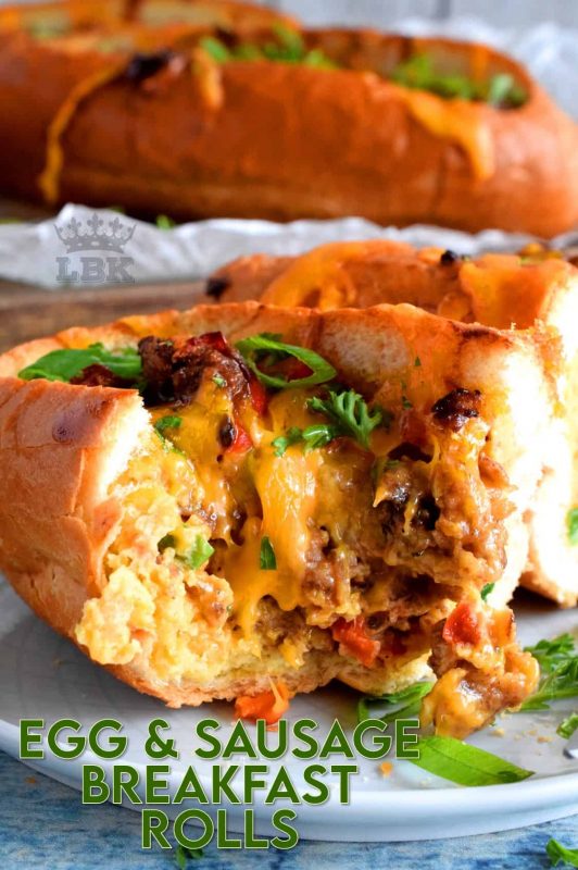 This dish has everything a good traditional breakfast needs - eggs, meat, and bread. Egg and Sausage Breakfast Rolls are delicious, easy, and fun too! It's as simple as hollowing out rolls, filling them with egg, sausage, and cheese, before baking them until the cheese is melted and bubbly. Sounds delicious, right? #sausage #sausageandegg #breakfast #sausagerolls #brunch