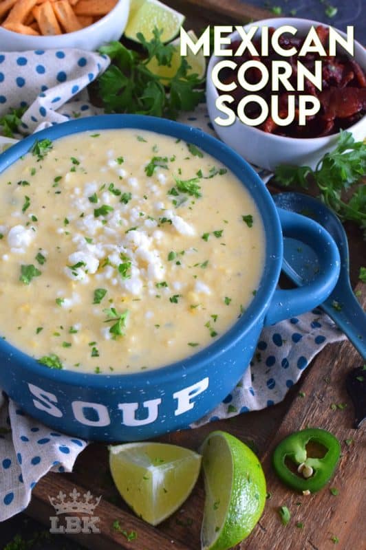 Prepared with sour cream and cream cheese, Mexican Corn Soup is warm and cozy, creamy and cheesy, and has a little bit of heat and zing. Serve with crumbled bacon, tortilla chips, and lime wedges. #mexican #cornsoup #mexicansoup #creamy #cheesy #soup