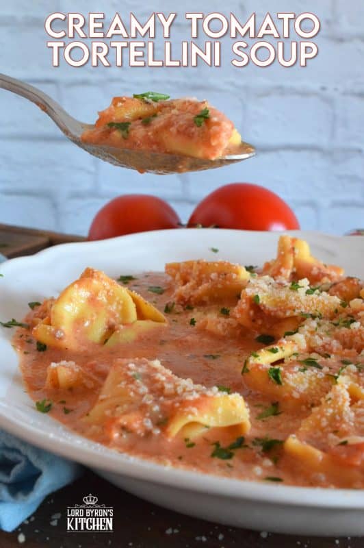 A quick and easy, hearty and cozy dinner, prepared with ready-made ingredients. Creamy Tomato Tortellini Soup is made with canned tomato soup, frozen pasta, and cream cheese. It is the ultimate cold-weather, family-friendly meal! #creamy #tortellini #tomatosoup #soupwithpasta #creamcheese #familyrecipes #meatlessmonday