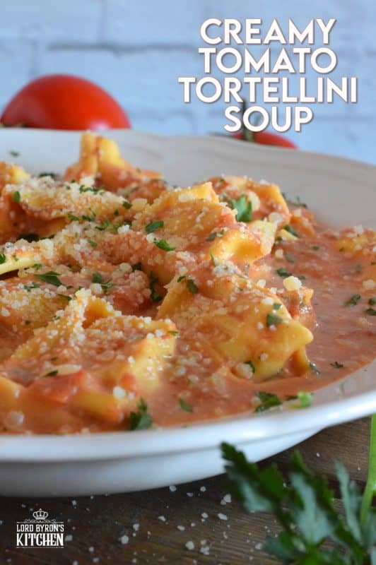 A quick and easy, hearty and cozy dinner, prepared with ready-made ingredients. Creamy Tomato Tortellini Soup is made with canned tomato soup, frozen pasta, and cream cheese. It is the ultimate cold-weather, family-friendly meal! #creamy #tortellini #tomatosoup #soupwithpasta #creamcheese #familyrecipes #meatlessmonday