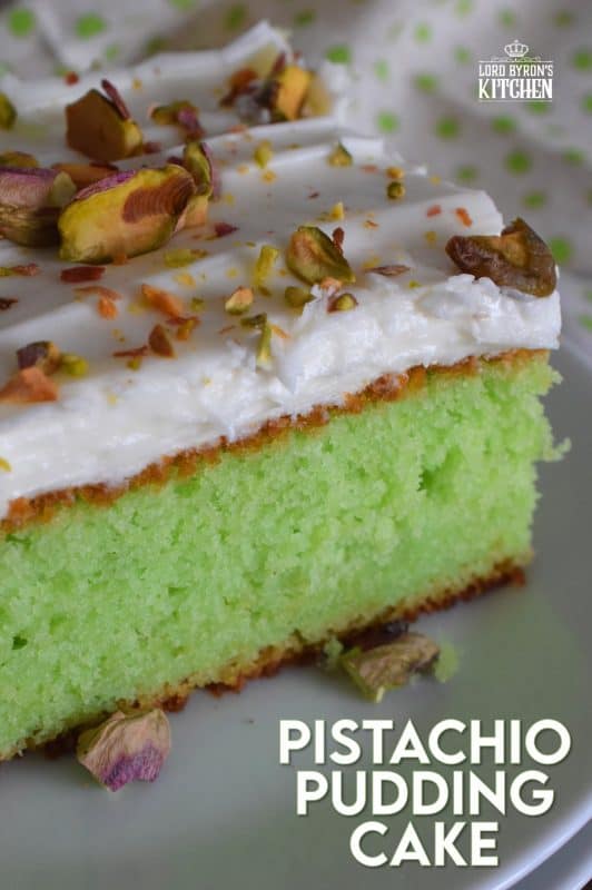 A light and fluffy, yet moist and flavourful Pistachio Pudding Cake topped with cream cheese frosting is perfectly green and festive. This is the ultimate green dessert for St. Patrick's Day! #pistachio #pudding #cake #sheetcake #stpatricksday #greenfood