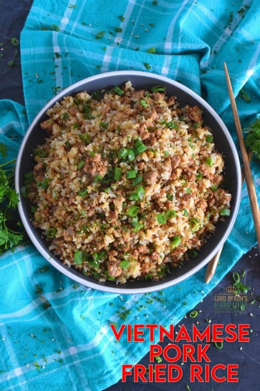 Leftover rice and ground pork are the main ingredients in Vietnamese Pork Fried Rice. Prepared with eggs, garlic, ginger, and green onions, and seasoned with fish sauce, this rice is a complete meal all on its own! #friedrice #pork #vietnameserecipes #porkfriedrice #skillet