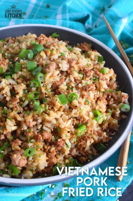 Leftover rice and ground pork are the main ingredients in Vietnamese Pork Fried Rice. Prepared with eggs, garlic, ginger, and green onions, and seasoned with fish sauce, this rice is a complete meal all on its own! #friedrice #pork #vietnameserecipes #porkfriedrice #skillet