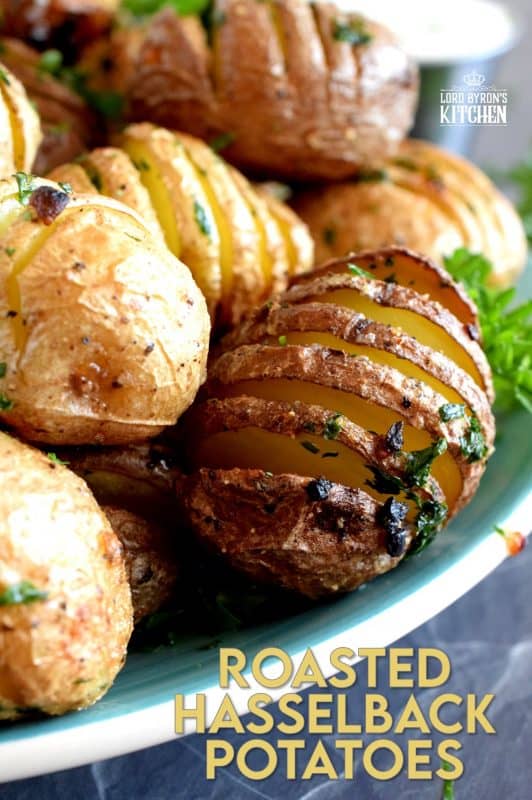 A beautiful side dish, a great little appetizer, or eat them all and call it a main! Roasted Hasselback Potatoes are fast and easy, budget-friendly, and oh, so delicious! I bet you can't eat just one! #babypotatoes #sidedishes #hasselback #bakedpotato