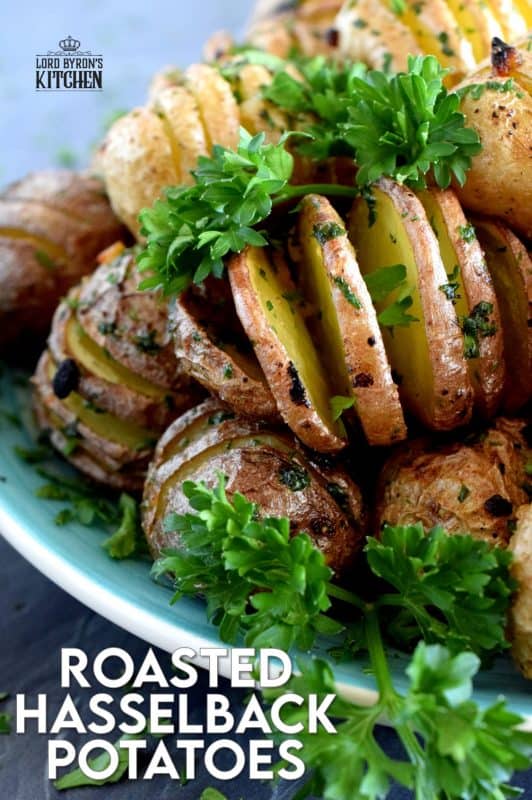 A beautiful side dish, a great little appetizer, or eat them all and call it a main! Roasted Hasselback Potatoes are fast and easy, budget-friendly, and oh, so delicious! I bet you can't eat just one! #babypotatoes #sidedishes #hasselback #bakedpotato