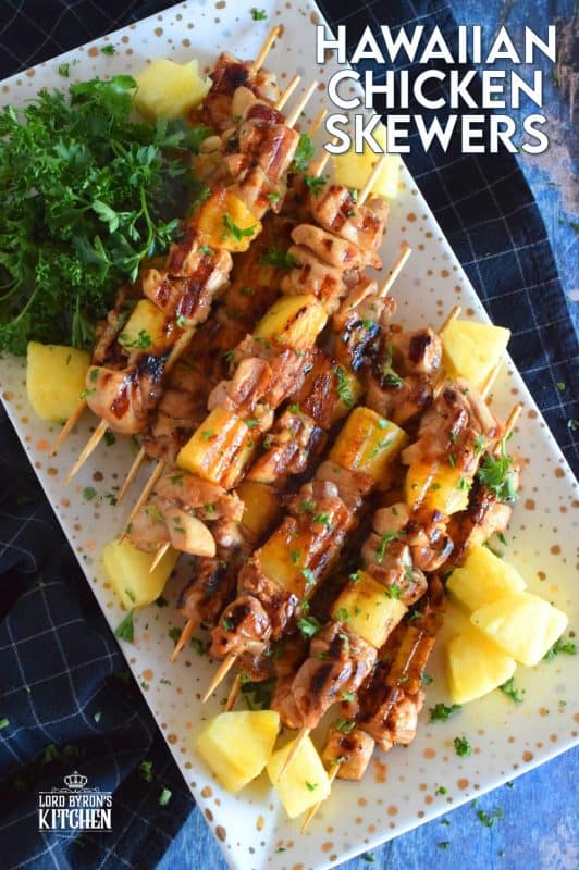 Hawaiian Chicken Skewers are prepared by marinating chicken thighs in mixture of pineapple juice, soy sauce, ginger, garlic, and dry mustard.  Grilled to perfection, with chunks of fresh pineapple, these chicken skewers are absolutely phenomenal! #hawaiian #chicken #pineapple #marinated #skewers #grilledchicken #summer #grilling