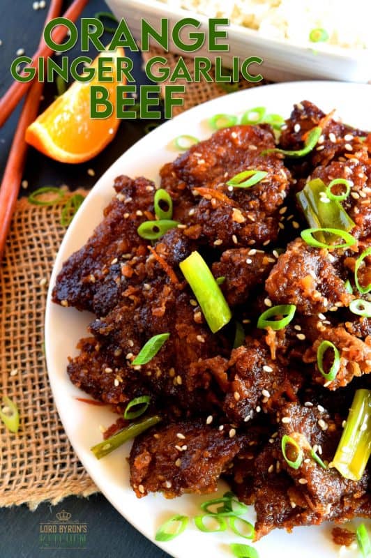 Orange Ginger Garlic Beef is a quick take-out inspired dish which packs a punch of flavour while using just a few fresh ingredients. The cooked beef is tossed in a thick, sweet sauce made with molasses and orange zest. It's absolutely delicious! #orange #beef #crispy #fried #sauce #ginger #garlic