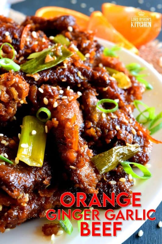 Orange Ginger Garlic Beef is a quick take-out inspired dish which packs a punch of flavour while using just a few fresh ingredients. The cooked beef is tossed in a thick, sweet sauce made with molasses and orange zest. It's absolutely delicious! #orange #beef #crispy #fried #sauce #ginger #garlic