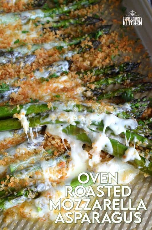Roasted Mozzarella Asparagus is a cheesy and garlicky side dish with gooey, melted cheese and buttery, crunchy crumb topping. Everyone will want an extra helping of this super easy and delicious side! #roasted #asparagus #crumb #topping #mozzarella #cheese