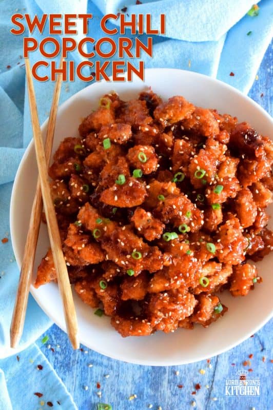 Marinated thigh meat, coated in panko and then baked until crispy, Sweet Chili Popcorn Chicken is then tossed in a homemade sauce which can be as mild or as hot as you prefer. It's sticky, sweet, spicy, moist, and tender! #popcornchicken #sweetheat #sweetchilithai #thai #bakedchicken #spicy #sticky