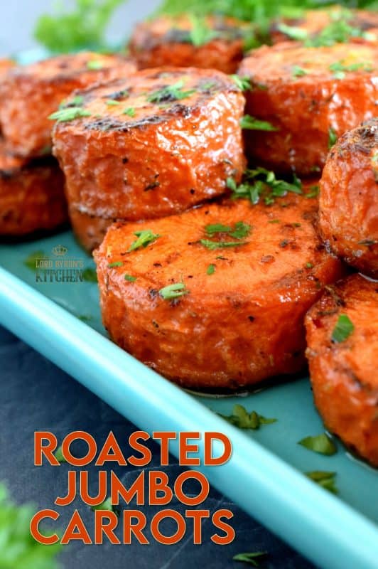 An easy, rustic, and budget friendly side dish that looks like a million bucks! Roasted Jumbo Carrots are browned and charred on the outside, but soft and tender on the inside. Perfectly seasoned and a great side dish to serve with almost any meal! #carrots #sides #vegetables #thanksgiving #roasted #roastedvegetables