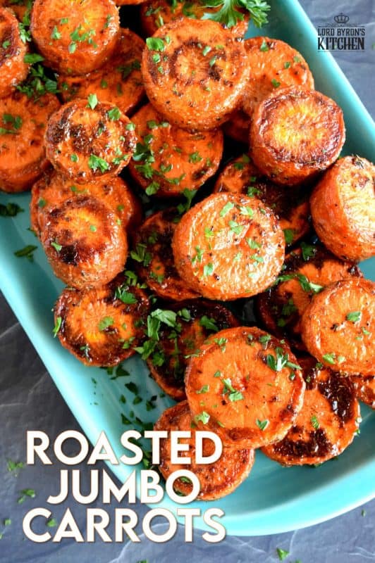 An easy, rustic, and budget friendly side dish that looks like a million bucks! Roasted Jumbo Carrots are browned and charred on the outside, but soft and tender on the inside. Perfectly seasoned and a great side dish to serve with almost any meal! #carrots #sides #vegetables #thanksgiving #roasted #roastedvegetables