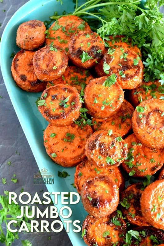 An easy, rustic, and budget friendly side dish that looks like a million bucks! Roasted Jumbo Carrots are browned and charred on the outside, but soft and tender on the inside. Perfectly seasoned and a great side dish to serve with almost any meal! #carrots #sides #vegetables #thanksgiving #roasted #roastedvegetables