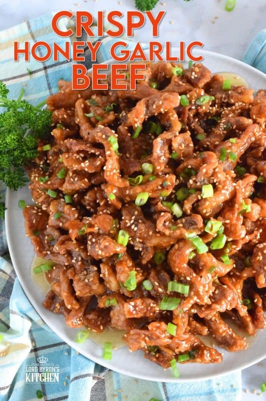 Thinly sliced beef, fried until crispy, and coated in a sweet and sticky honey garlic sauce. Crispy Honey Garlic Beef takes about 30 minutes from start to finish, and it is a wonderfully and budget-friendly main. Serve with rice and steamed veggies for a complete meal! #honeygarlic #crispybeef #beef #takeout #asian #chinese #restaurant