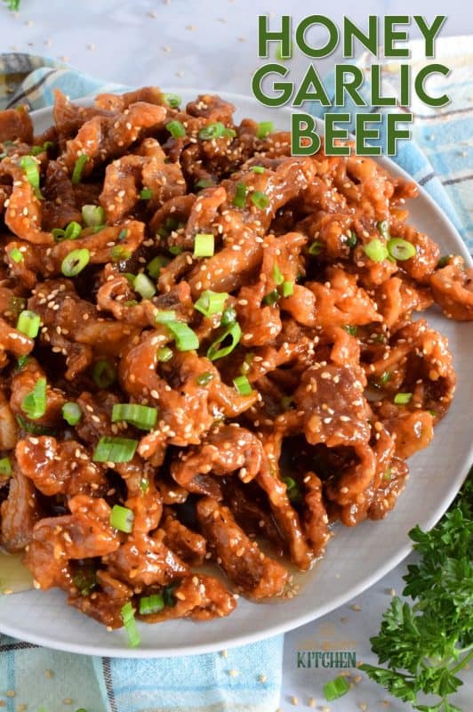 Thinly sliced beef, fried until crispy, and coated in a sweet and sticky honey garlic sauce. Crispy Honey Garlic Beef takes about 30 minutes from start to finish, and it is a wonderfully and budget-friendly main. Serve with rice and steamed veggies for a complete meal! #honeygarlic #crispybeef #beef #takeout #asian #chinese #restaurant