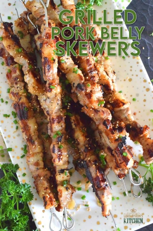 Marinated pork belly is skewered and grilled to perfection in this Asian-inspired recipe. The marinade tenderizes the pork and draws out some of the fat so that the pork can be grilled quickly on a high heat while keeping the meat moist and delicious. #pork #porkbelly #grilledpork #asian #skewers #kebabs #grilling #summer