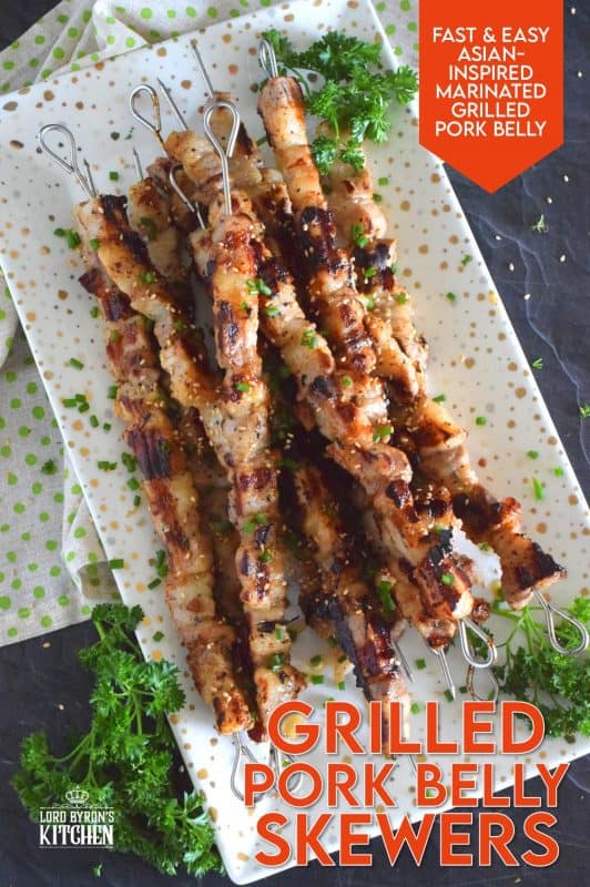 Marinated pork belly is skewered and grilled to perfection in this Asian-inspired recipe. The marinade tenderizes the pork and draws out some of the fat so that the pork can be grilled quickly on a high heat while keeping the meat moist and delicious. #pork #porkbelly #grilledpork #asian #skewers #kebabs #grilling #summer