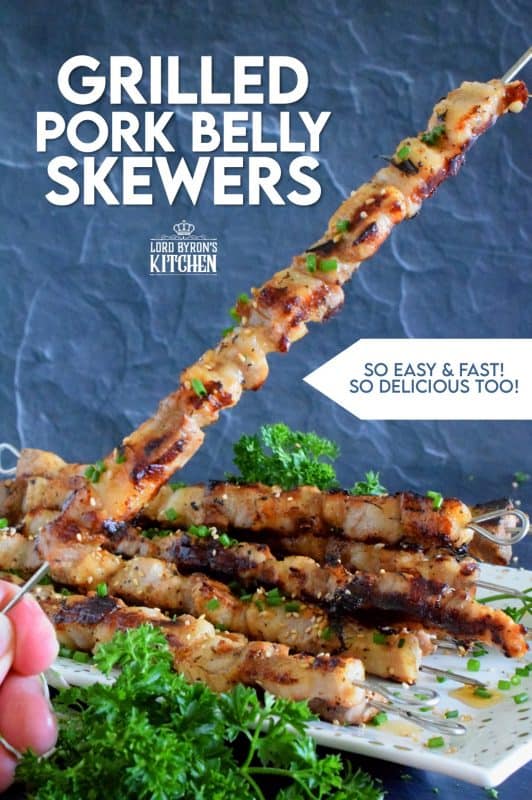 Marinated pork belly is skewered and grilled to perfection in this Asian-inspired recipe. The marinade tenderizes the pork and draws out some of the fat so that the pork can be grilled quickly on a high heat while keeping the meat moist and delicious. #pork #porkbelly #grilledpork #asian #skewers #kebabs #grilling #summer
