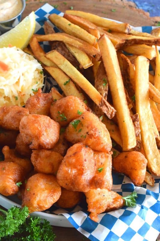 Unlike most fish batters that are made with beer, this one is made with a well seasoned buttermilk pancake batter from a box! It sounds a little strange, but it's absolutely delicious! Fried until crispy, the fish is perfectly cooked and surrounded by slightly sweet, light and airy batter - yum! #pancake #buttermilk #friedfish #fishandchips #batteredfish #buttermilkpancakes
