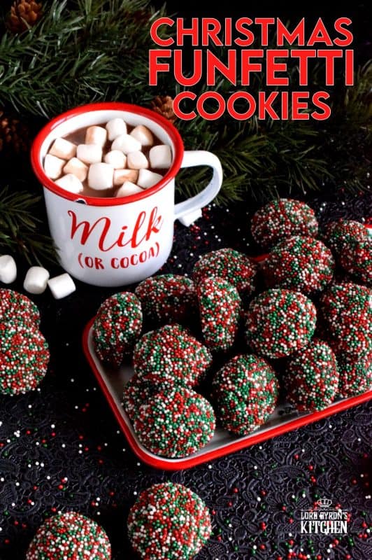 A simple mix, roll, and bake cookie with a deep, rich chocolate flavour. Christmas Funfetti Cookies are ideal for holiday baking with kids! These make a lovely gift idea too, because they can be packaged without much risk of crumbling! #christmas #holiday #baking #cookies #funfetti #chocolate #sprinkles #kids