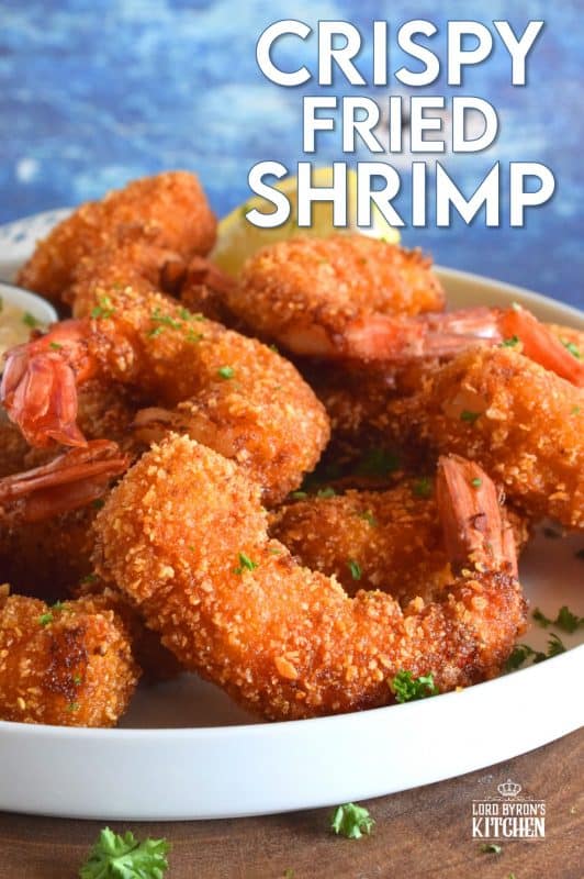Looking for crunch factor? Look no further! Crispy Fried Shrimp have perfectly cooked succulent shrimp on the inside and a big-bite worthy crunch on the outside. This is most definitely a repeat recipe! #shrimp #friedseafood #friedshrimp #battered #crispy #seafood